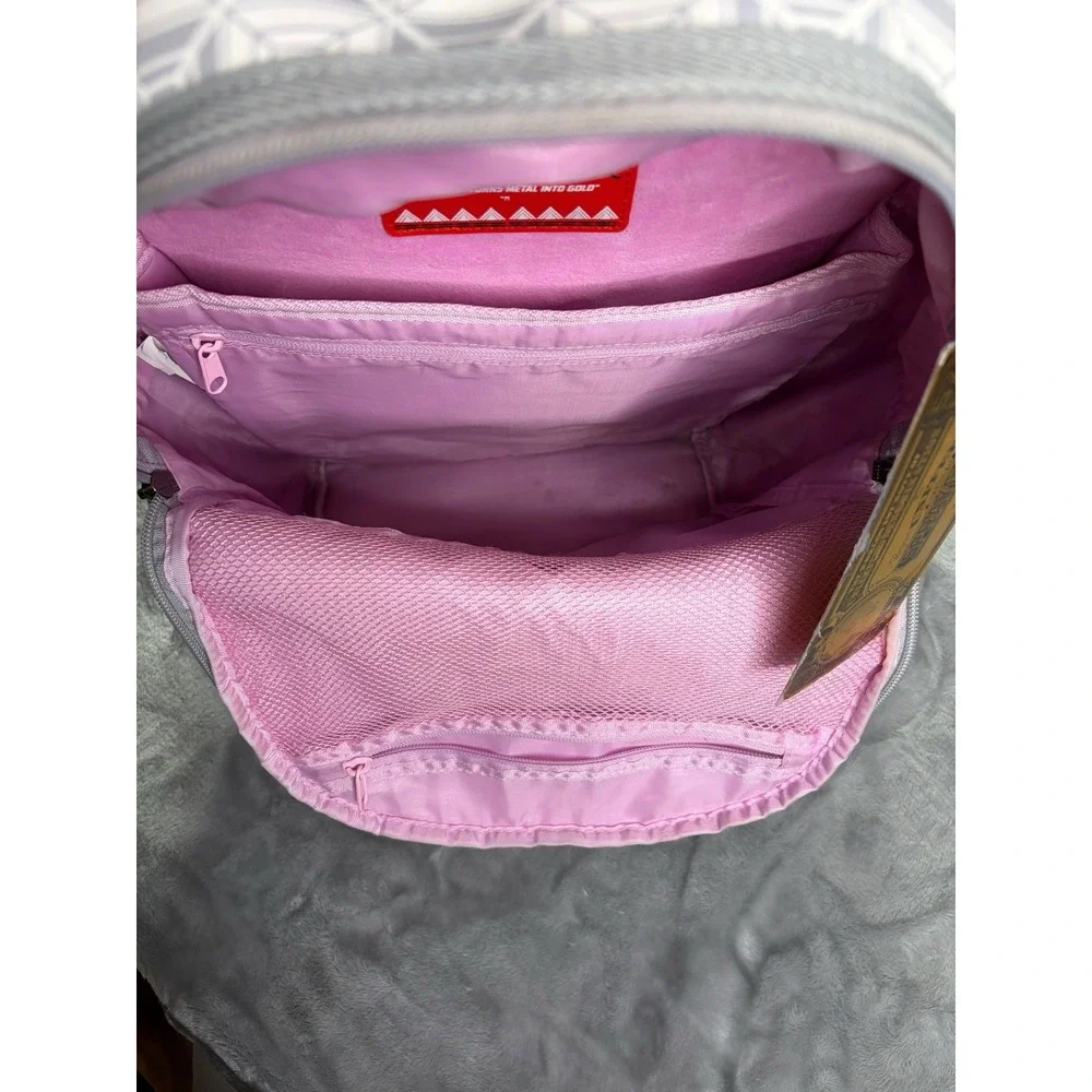 Sprayground A.I. African Intelligence DBX Sandflower Hiking Backpack Gray Pink